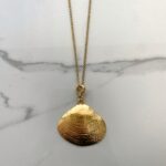 echo, gold tone shell  necklace