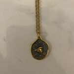 Black eye necklace