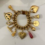 gold charm bracelet , vintage style jewllery brand , statement trendy jewllery collection