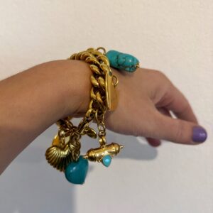 gold charm bracelet , trendy jewllery brand , vintage style bracelet , statement jewllery collection