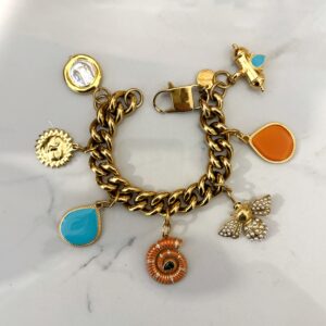 gold charm bracelet , trendy jewllery brand , vintage style bracelet , statement jewllery collection