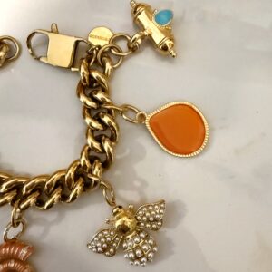gold charm bracelet , trendy jewllery brand , vintage style bracelet , statement jewllery collection