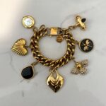 gold charm bracelet , trendy jewllery brand , vintage style bracelet , statement jewllery collection