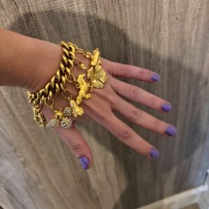 gold charm bracelet , trendy jewllery brand , vintage style bracelet , statement jewllery collection
