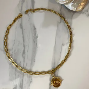 coin jewllery , gold charm bracelet , greek jewllery brand , statement jewllery collection , coin necklace , bold chunky jewllery , retro vintage style , medallion bracelet , Ancient Greek style , evil eye jewllery